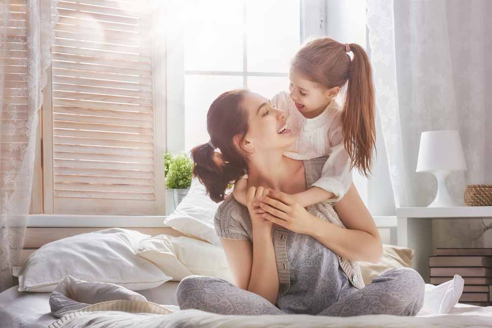 mother and daughter smiling