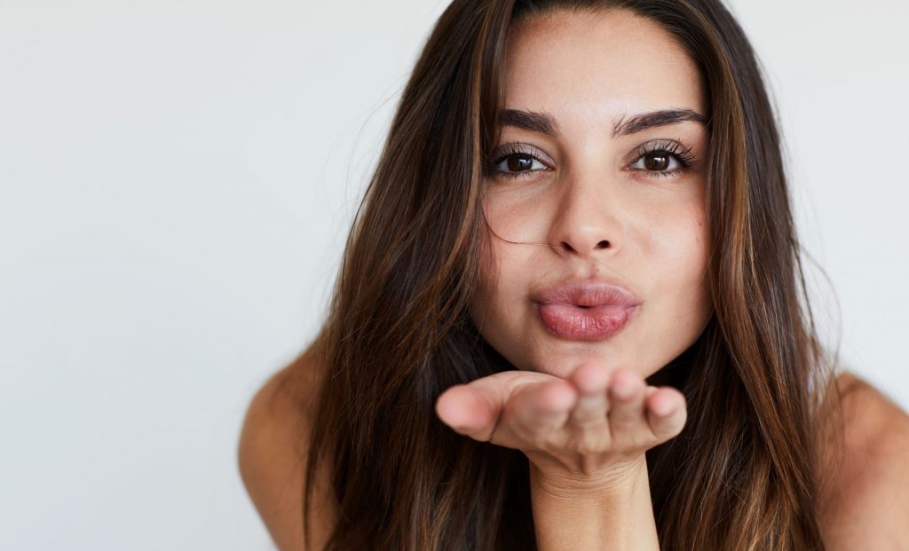 Woman blowing a kiss