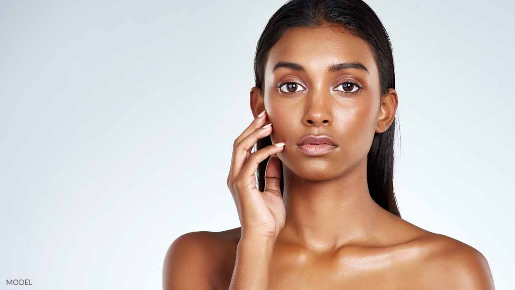 A women with long hair and glowing skin (model).